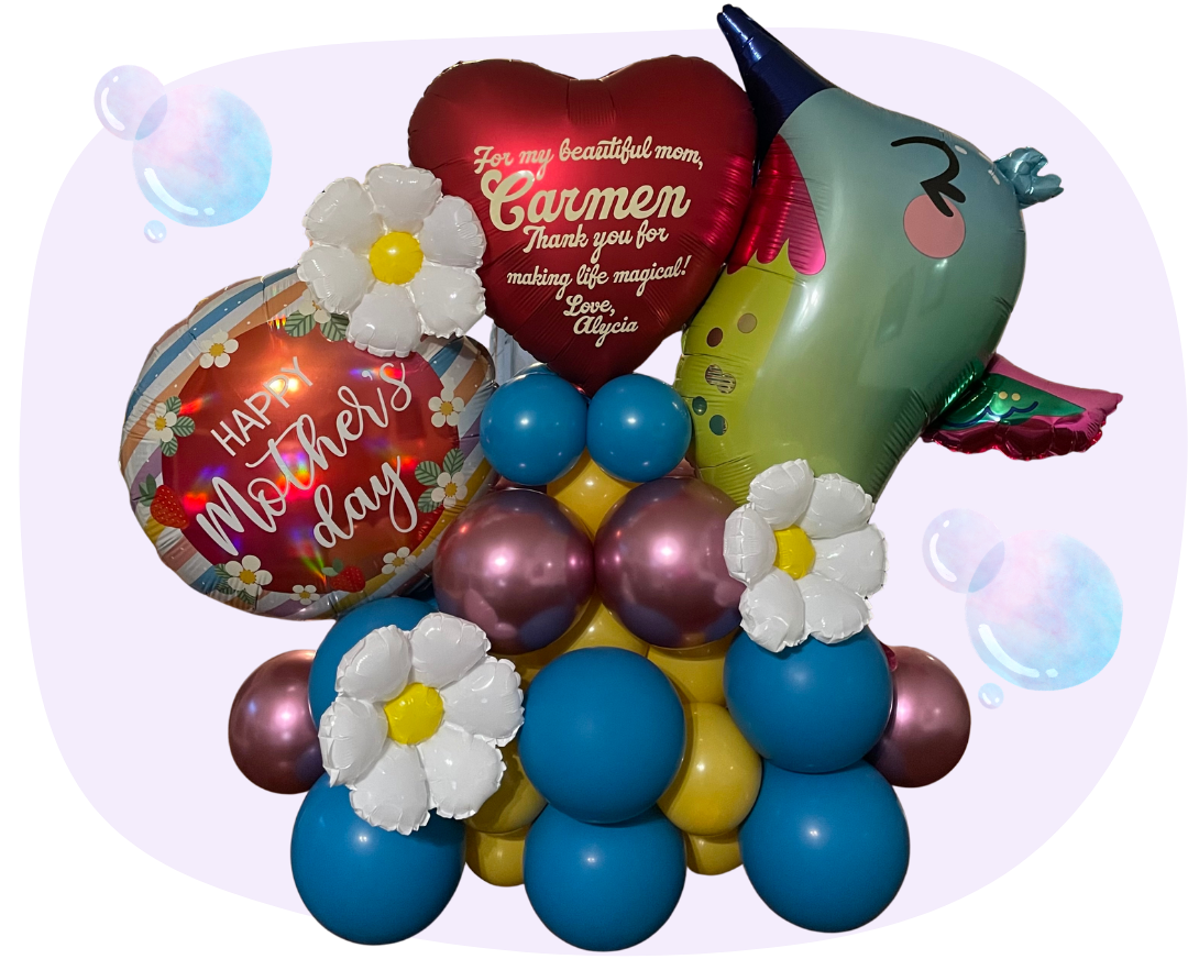 A colorful balloon arrangement for Mother's Day featuring a 'Happy Mother's Day' round balloon, a heart-shaped balloon with a message for mom, a unicorn-shaped balloon, white flowers, and various smaller balloons in pink, blue, yellow, and purple colors.