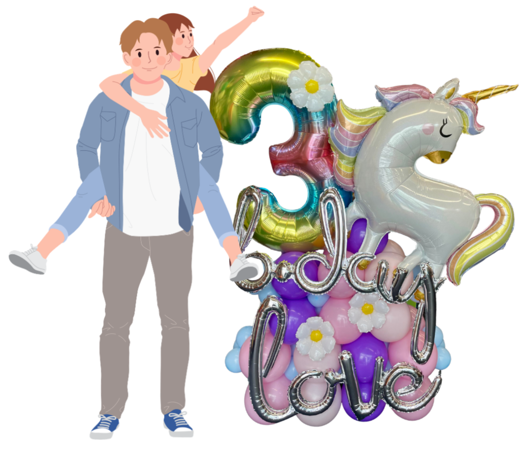A father with a young girl on his back stands next to colorful balloons, including a large white unicorn, rainbow-shaped balloons, and a balloon display spelling out "love" and the number "3," surrounded by white flowers, celebrating a third birthday.