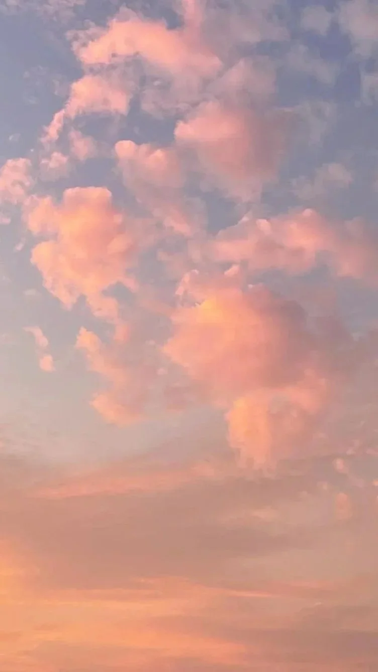 Pink and purple clouds in a sunset sky.