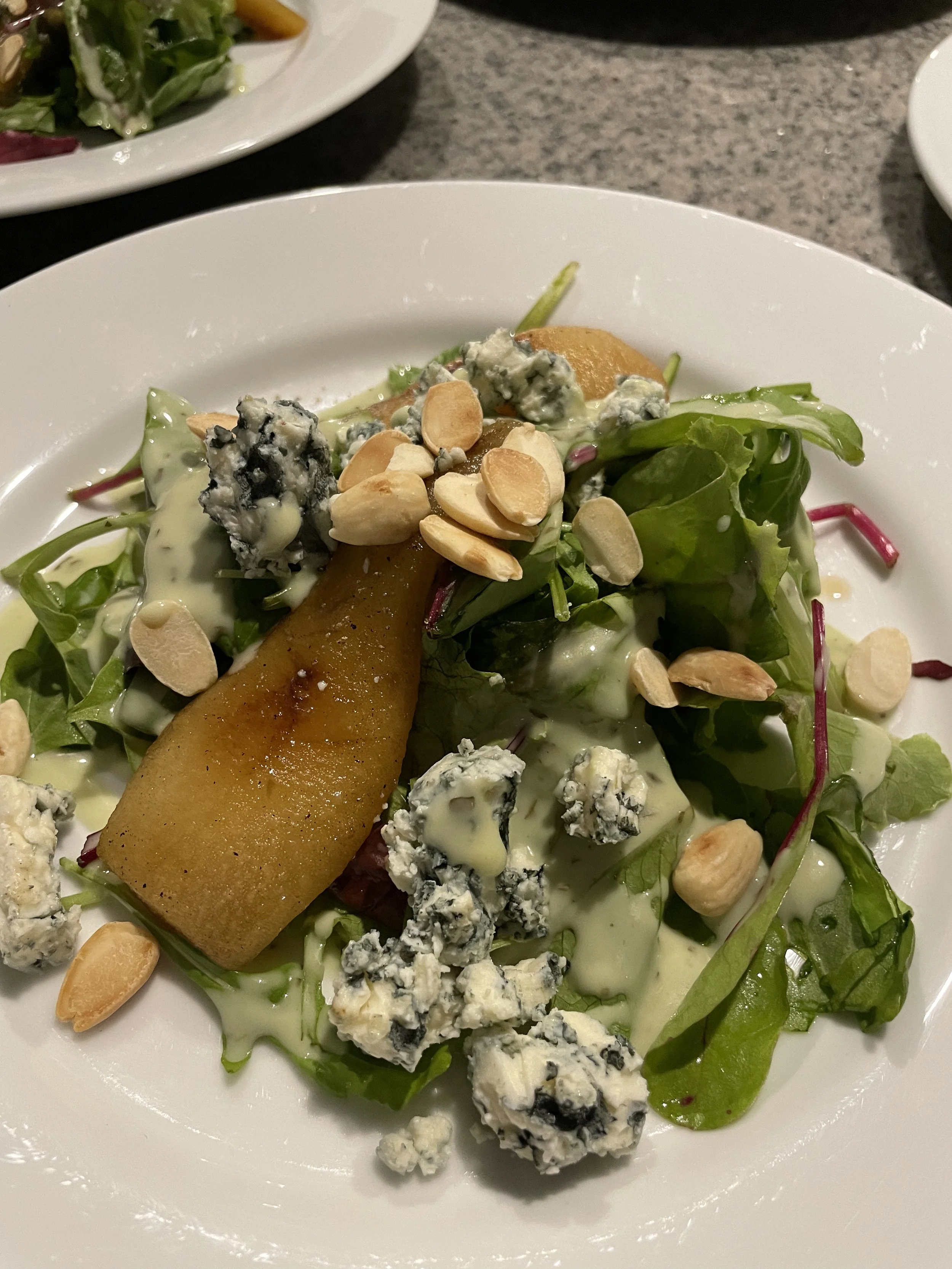 Grilled pear salad with pecans and blue cheese served at private chef dinner in Aruba.