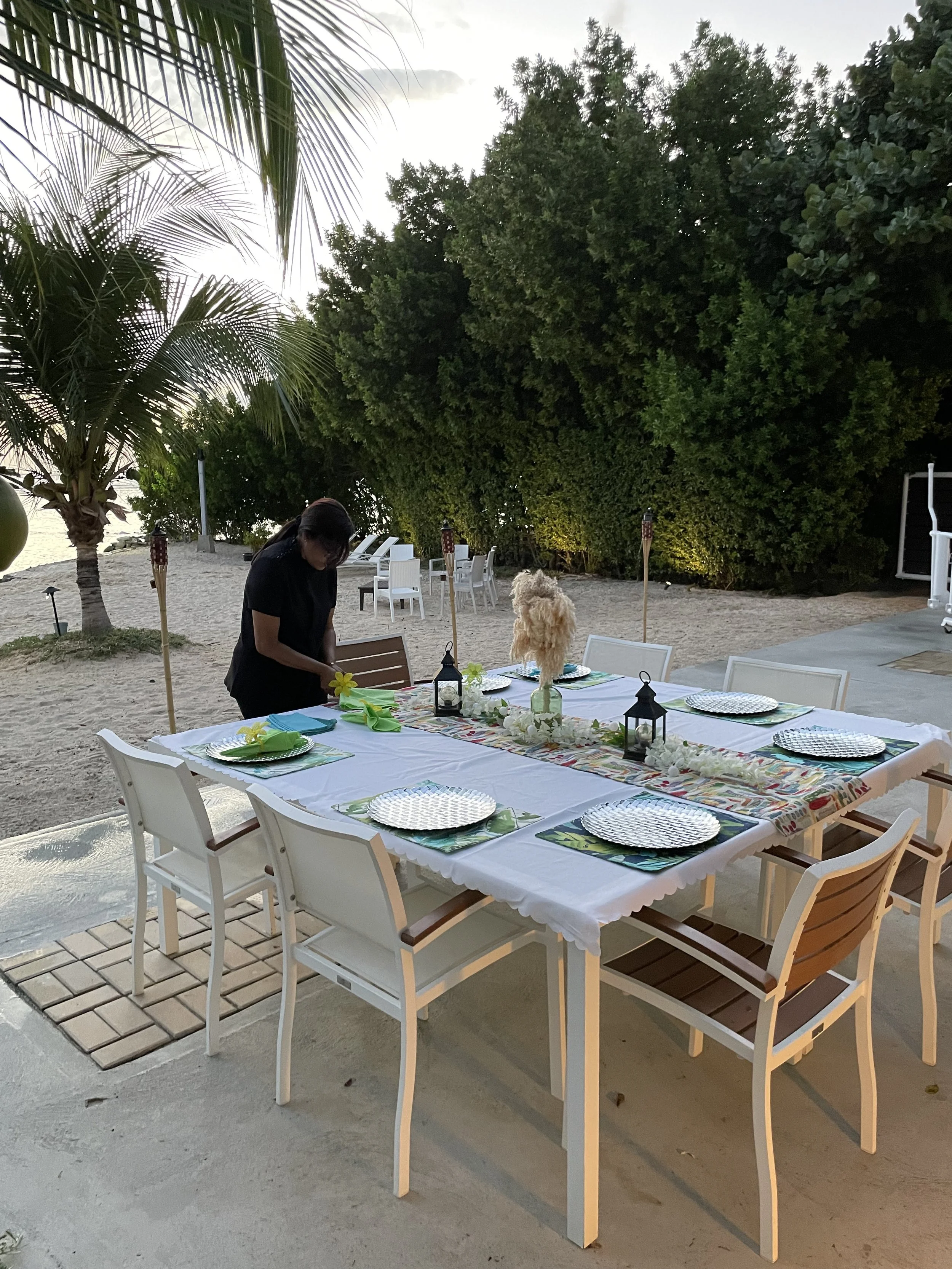 Private chef dinner table setup at Aruba beachfront villa with ocean view.