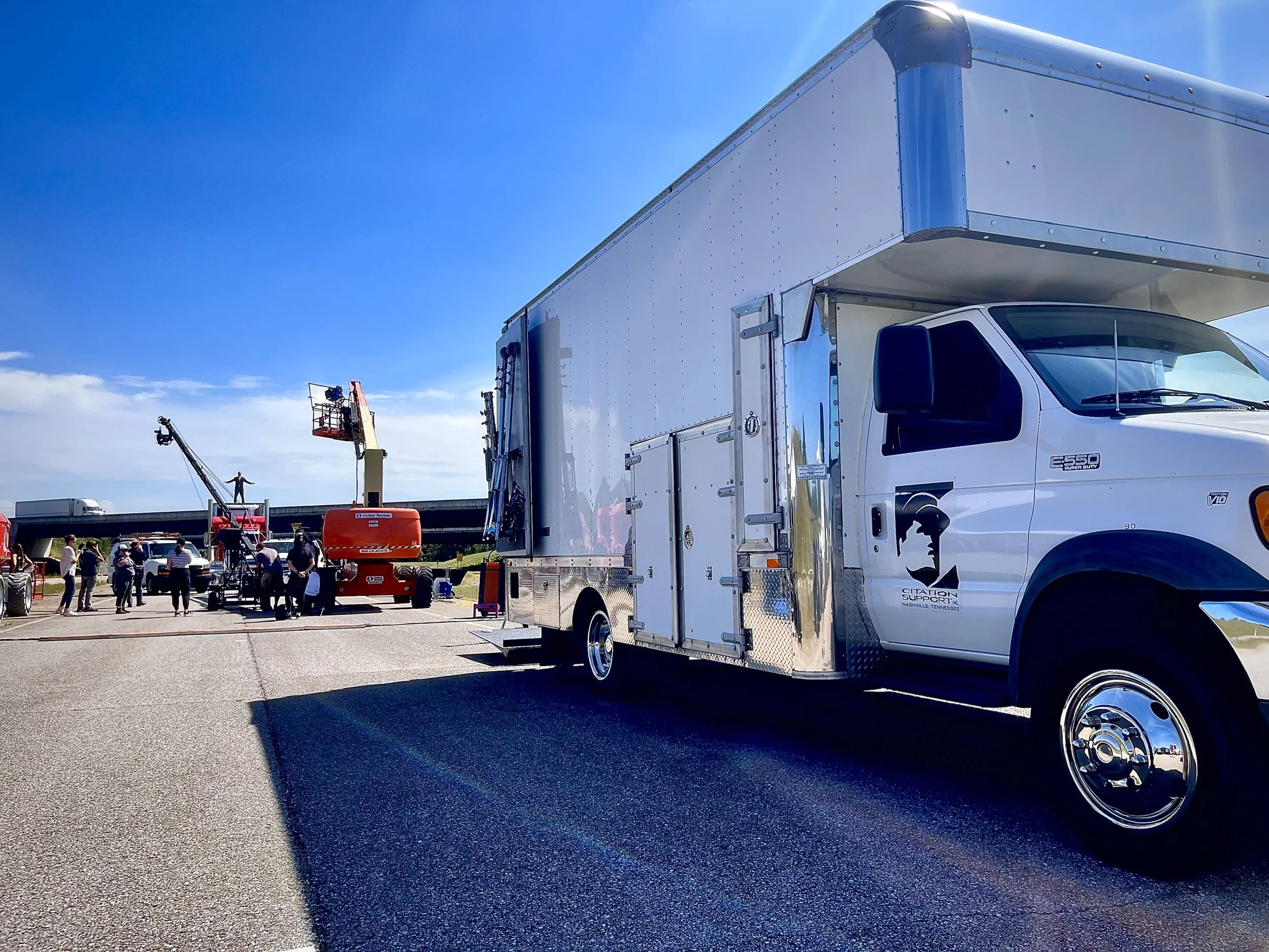 Grip truck from Citation Support on a film production set in Middle Tennessee with lighting and grip equipment set up for a commercial video shoot