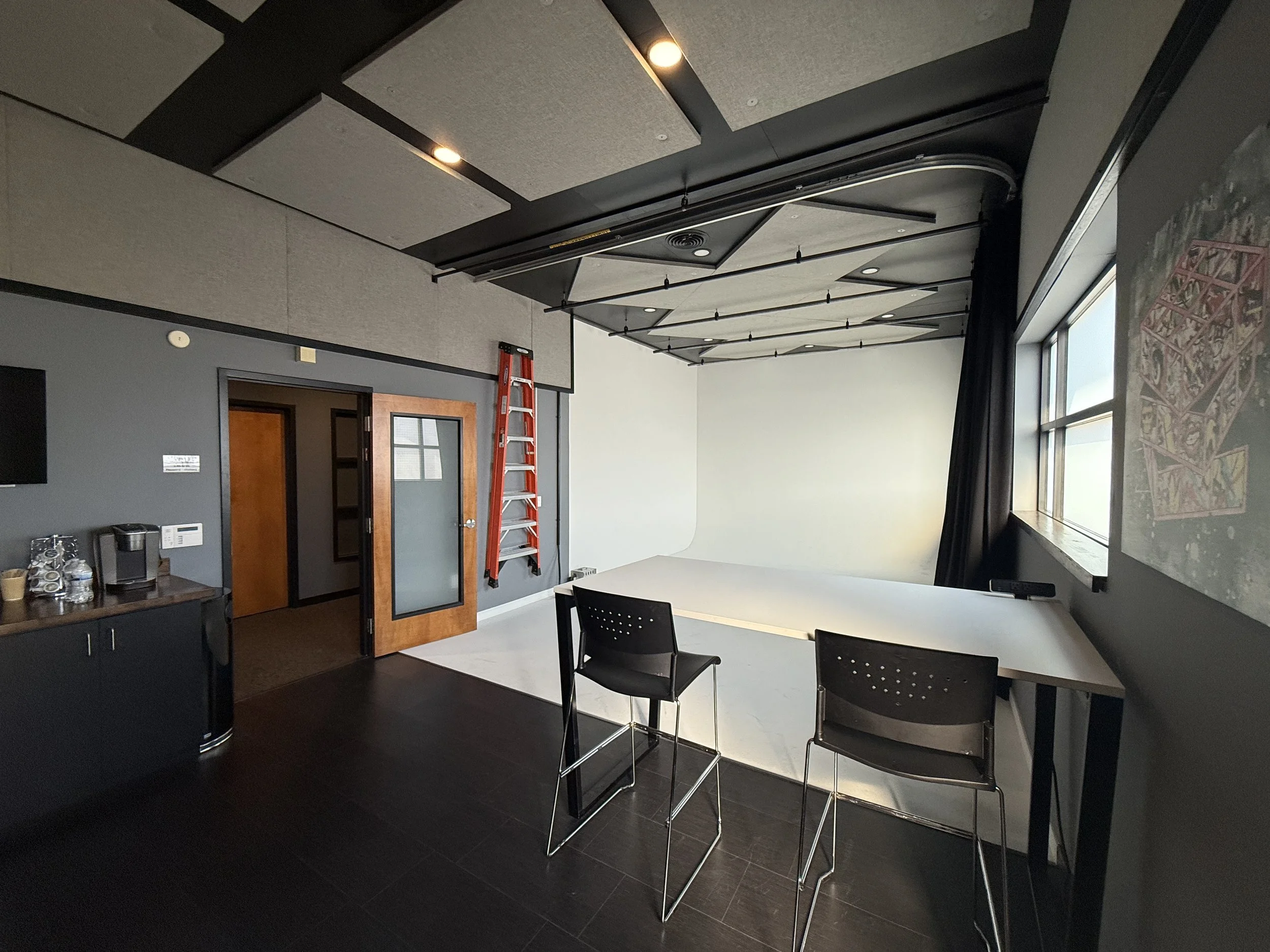 Small production studio in Nashville TN for interviews and content creation, featuring cyclorama wall and workspace at Citation Support Breakroom Studio