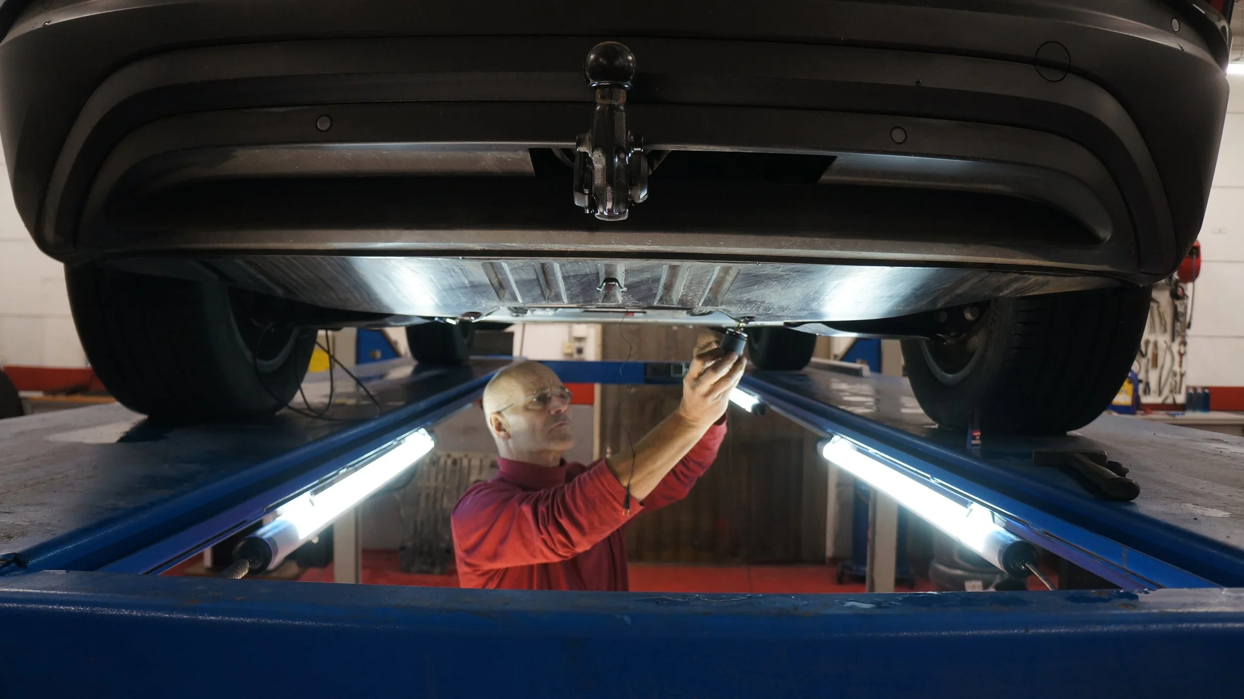 Engineering team working with acoustic and structural excitation equipment