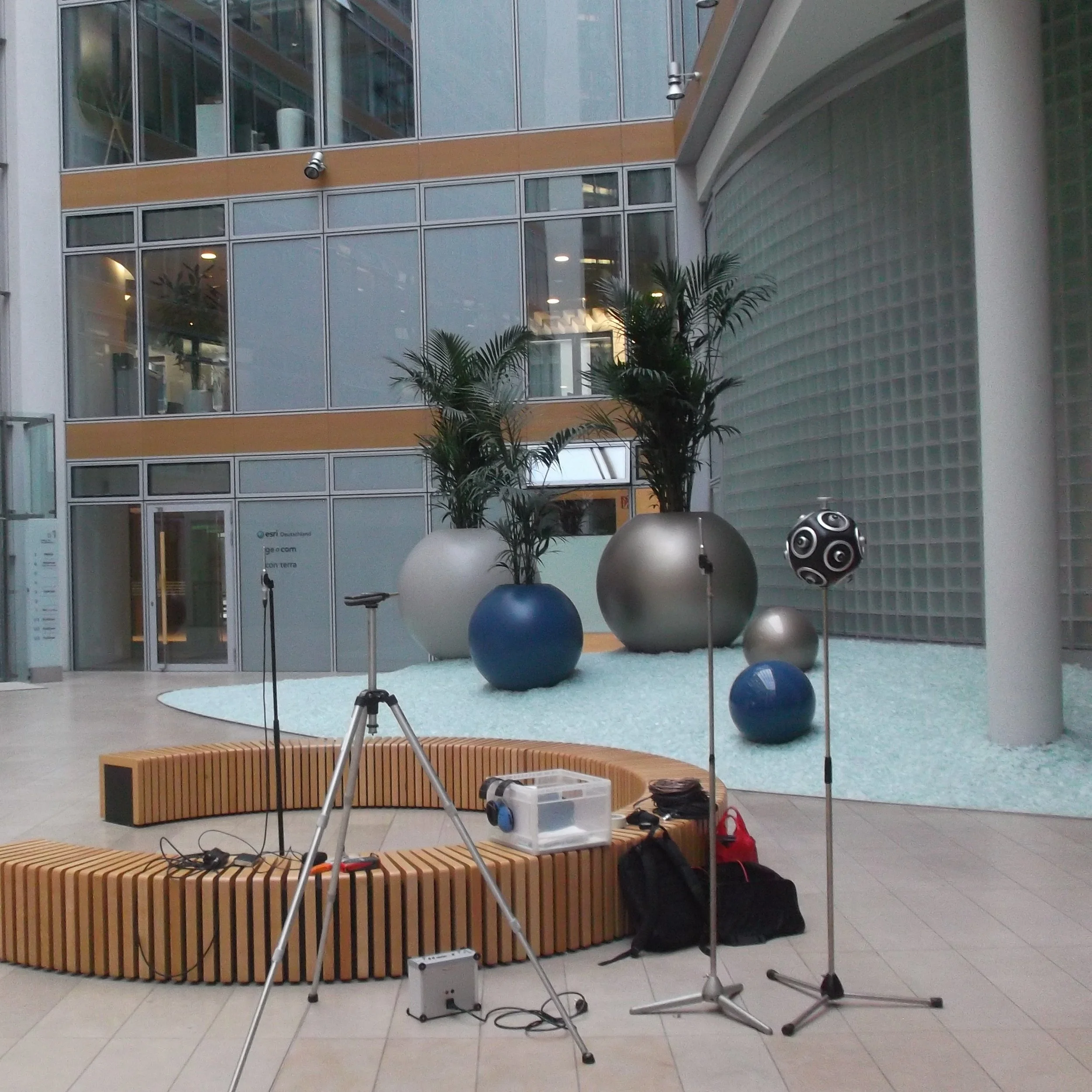 Building acoustics measurement setup using Qohm sound source and microphones in a large hall