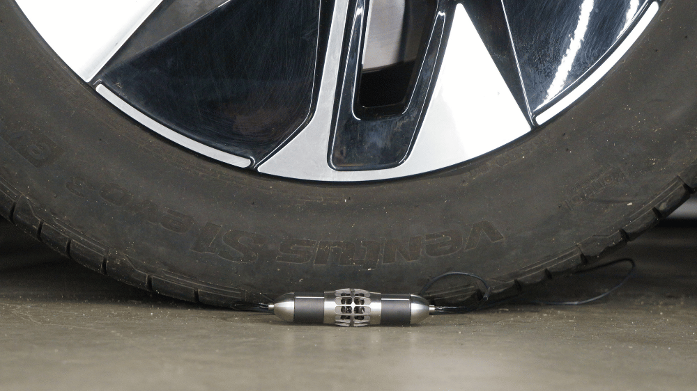 Close-up of Qind2 miniature volume source positioned for low-frequency acoustic excitation