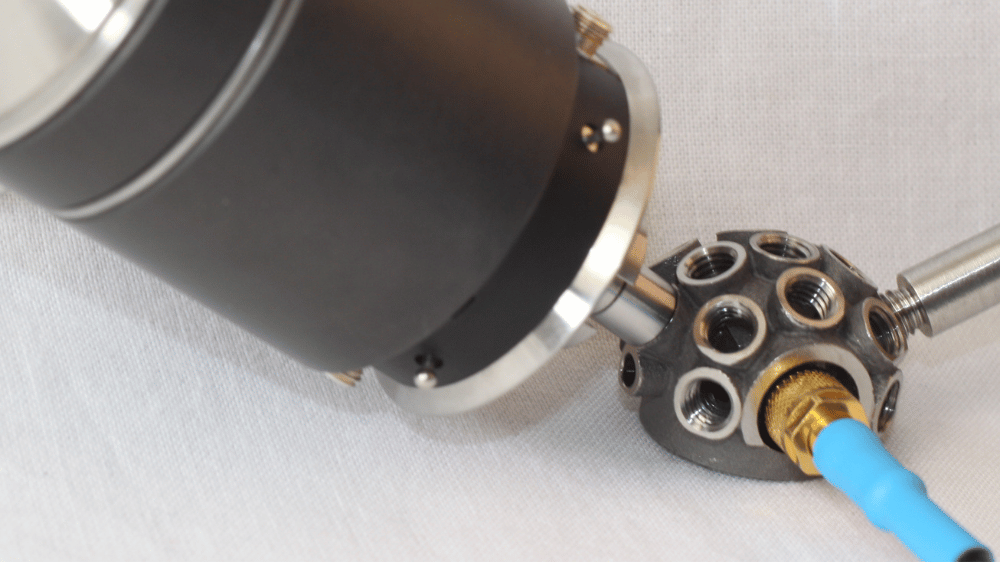 Close-up of Qtrx coupler showing multi-axis interface for 3D accelerance and impedance measurements