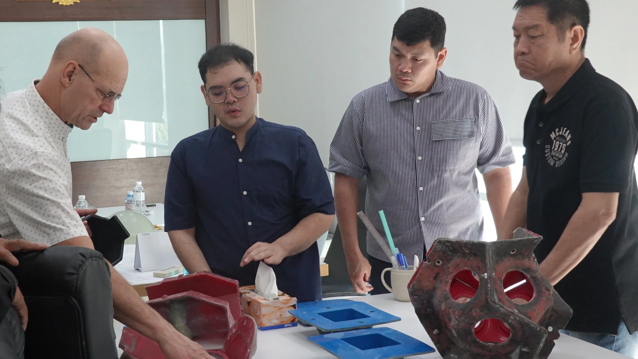 Product development discussion with international partners at Qsources