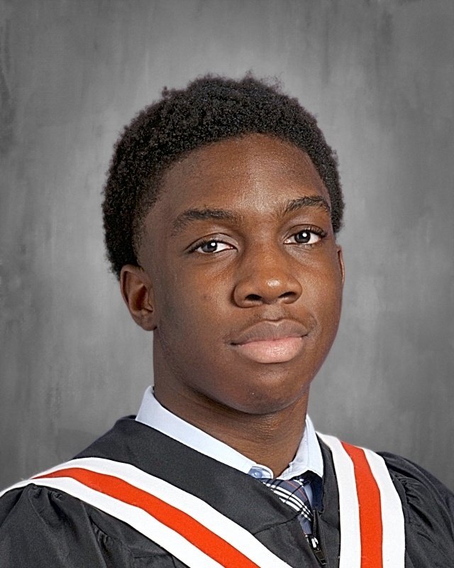 Young Black man in graduation gown and tie