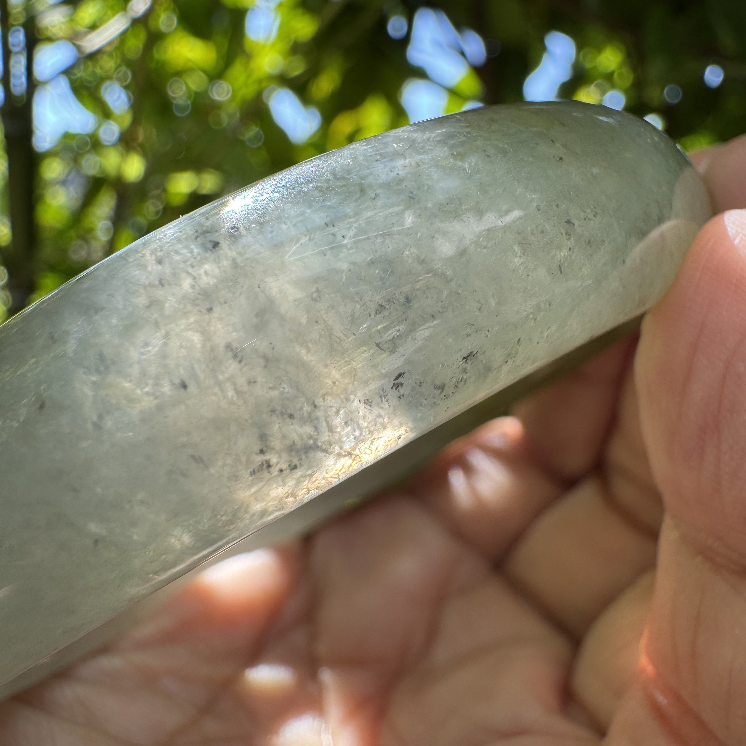 exceptional icy jadeite with natural inclusions