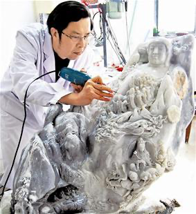 Carving  a Large jade sculpture of Guanyin
