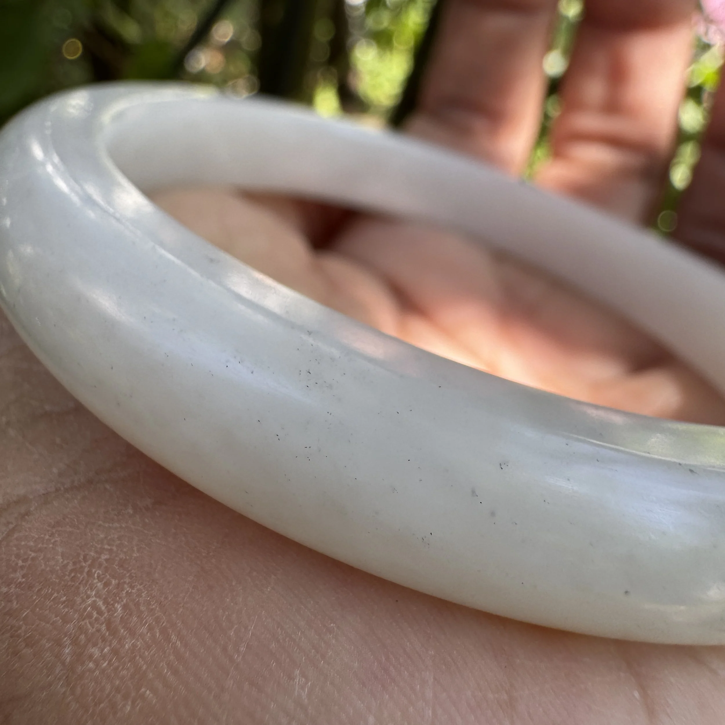 The silky smooth surface of a Xinjiang Ziliao nephrite jade