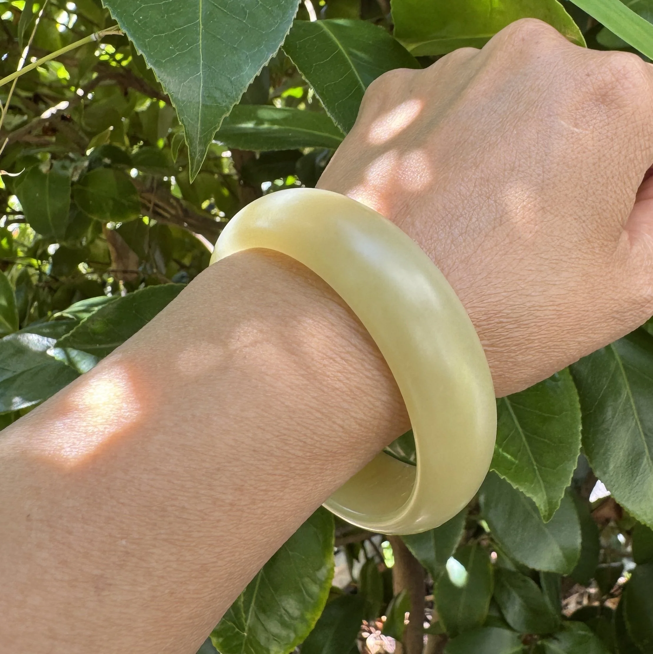 Natural Hetian golden brown sugar nephrite jade bangle worn on the wrist