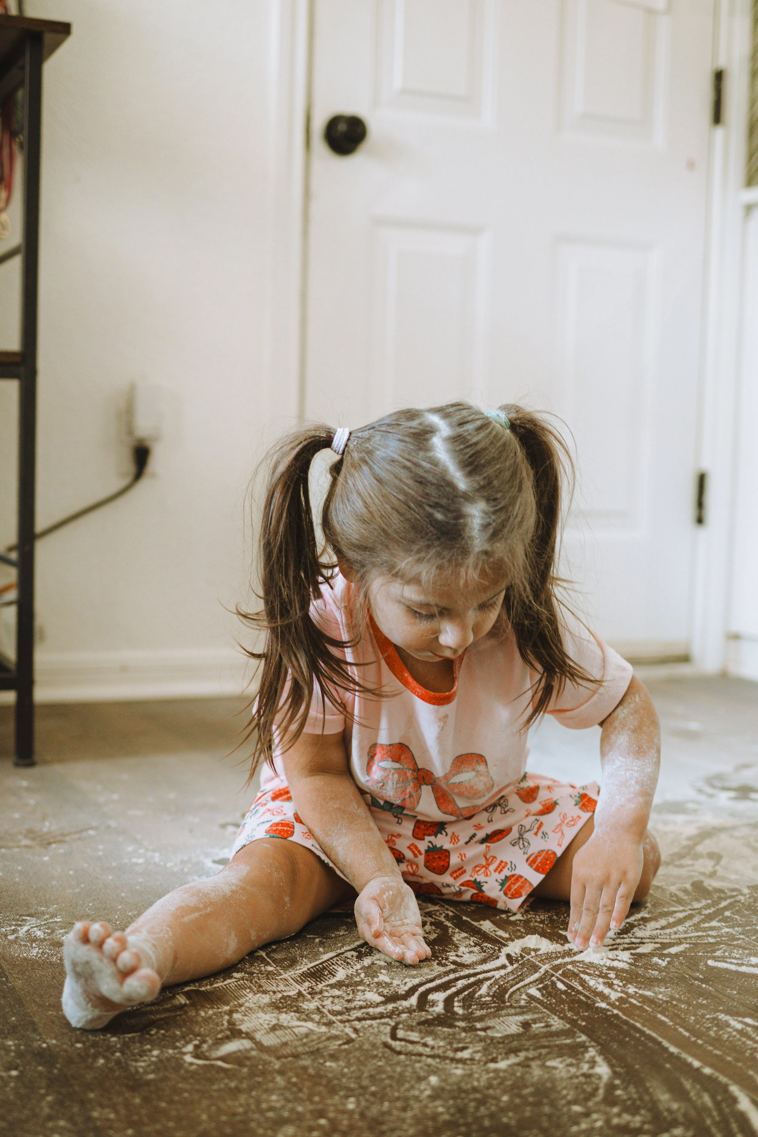Family making breakfast together during an in-home family photo session
