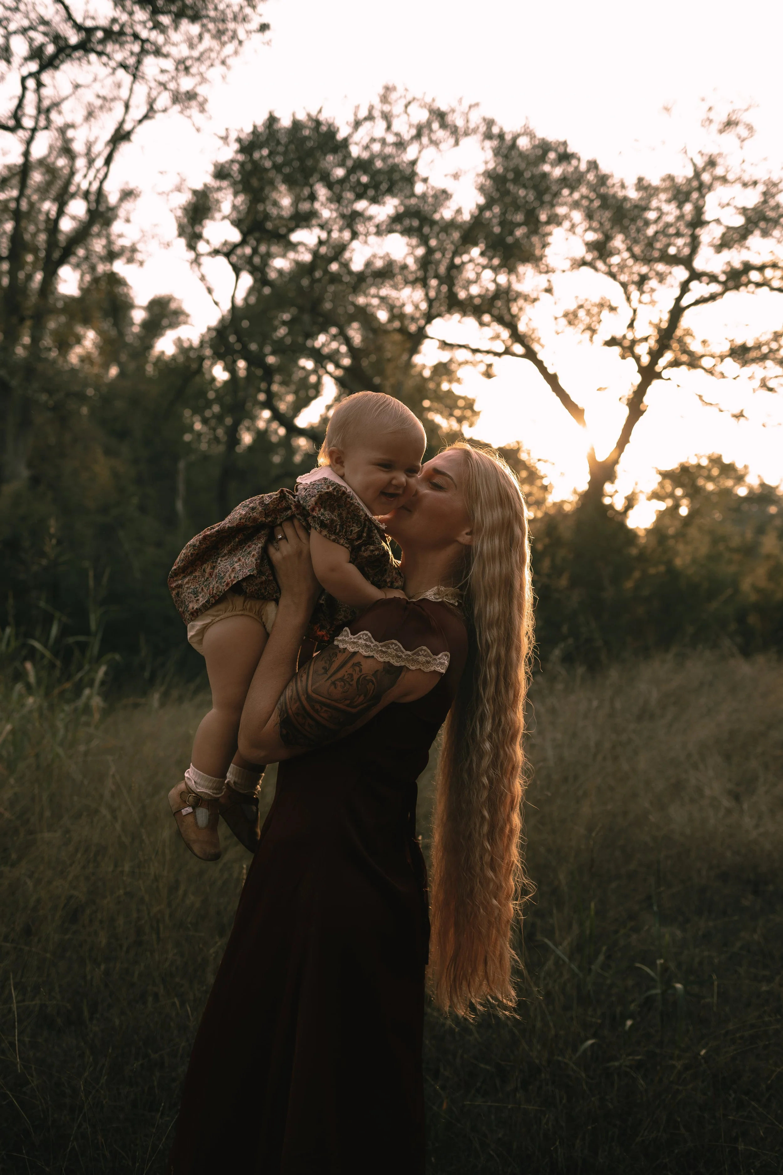 mother holding baby in field Austin Texas