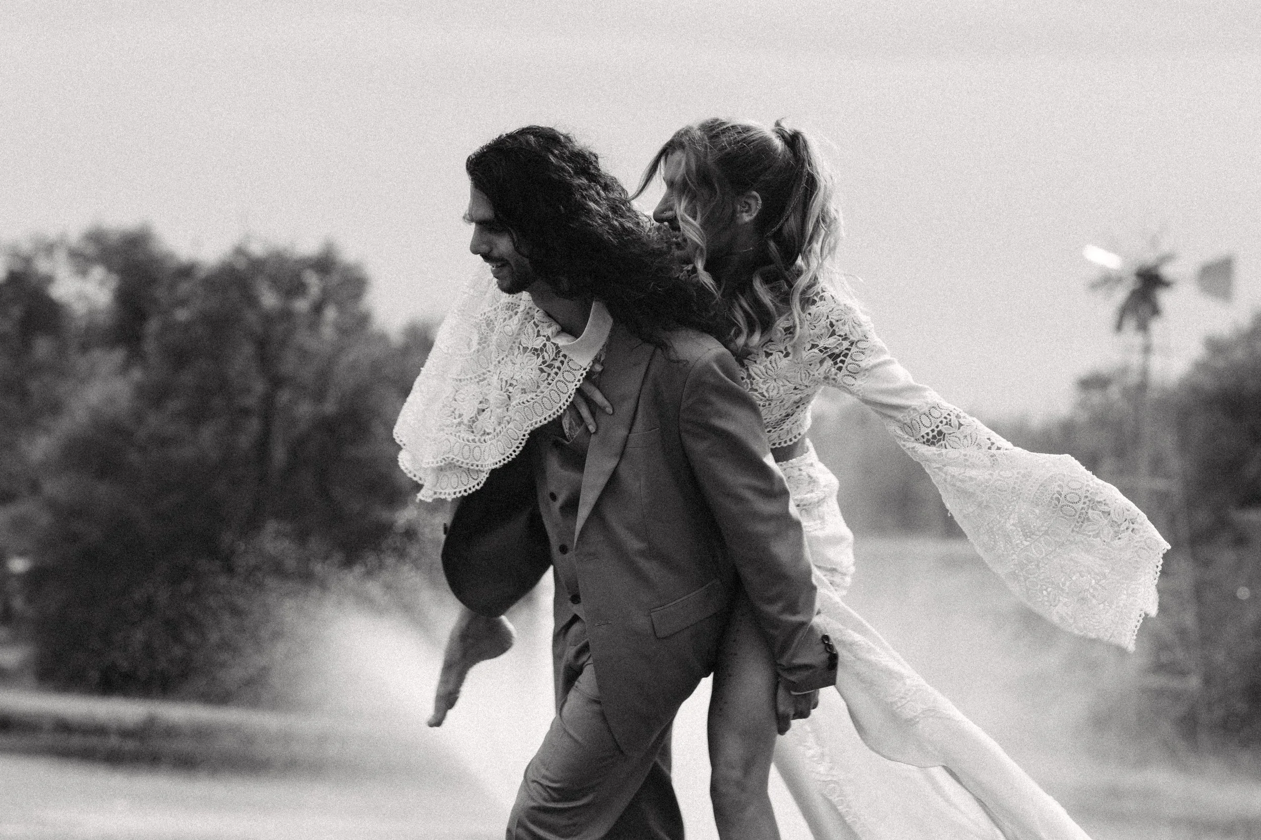 Bride Piggy Back by Groom, The Ma Mansion, Hill Country, Texas