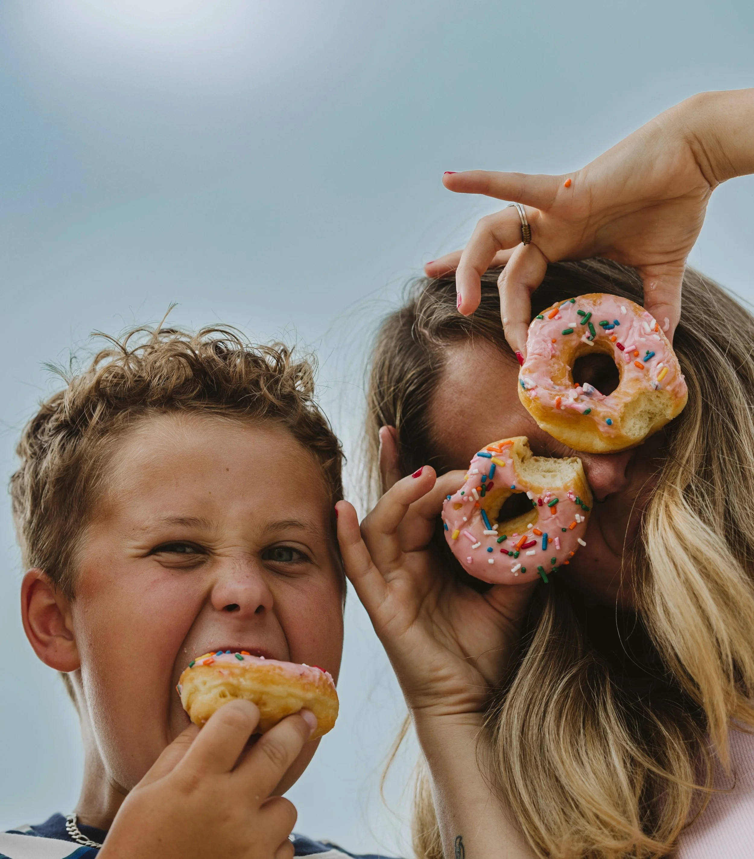 Family enjoying donuts during a colorful skatepark adventure