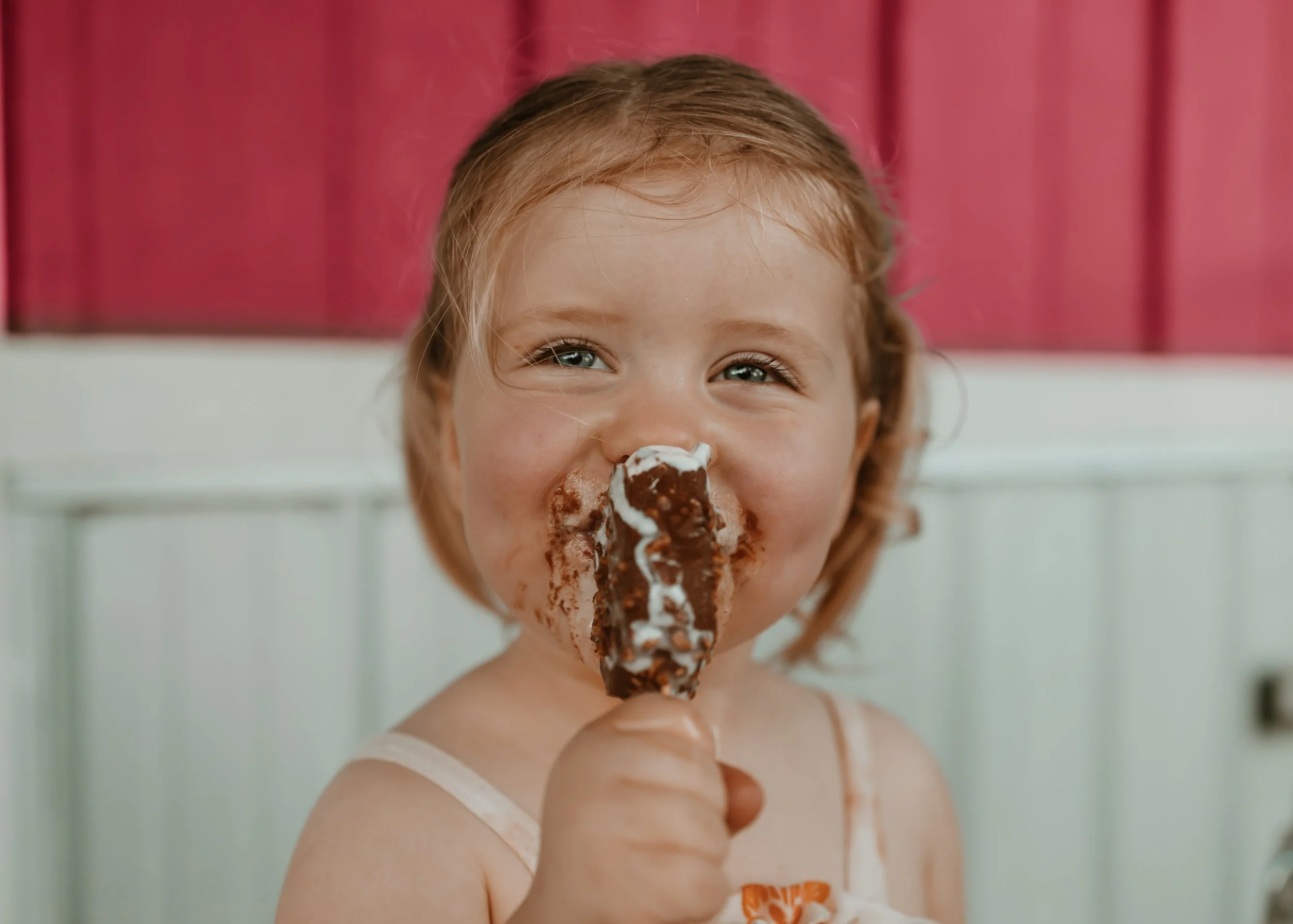 Family sharing ice cream during a colorful summer outing