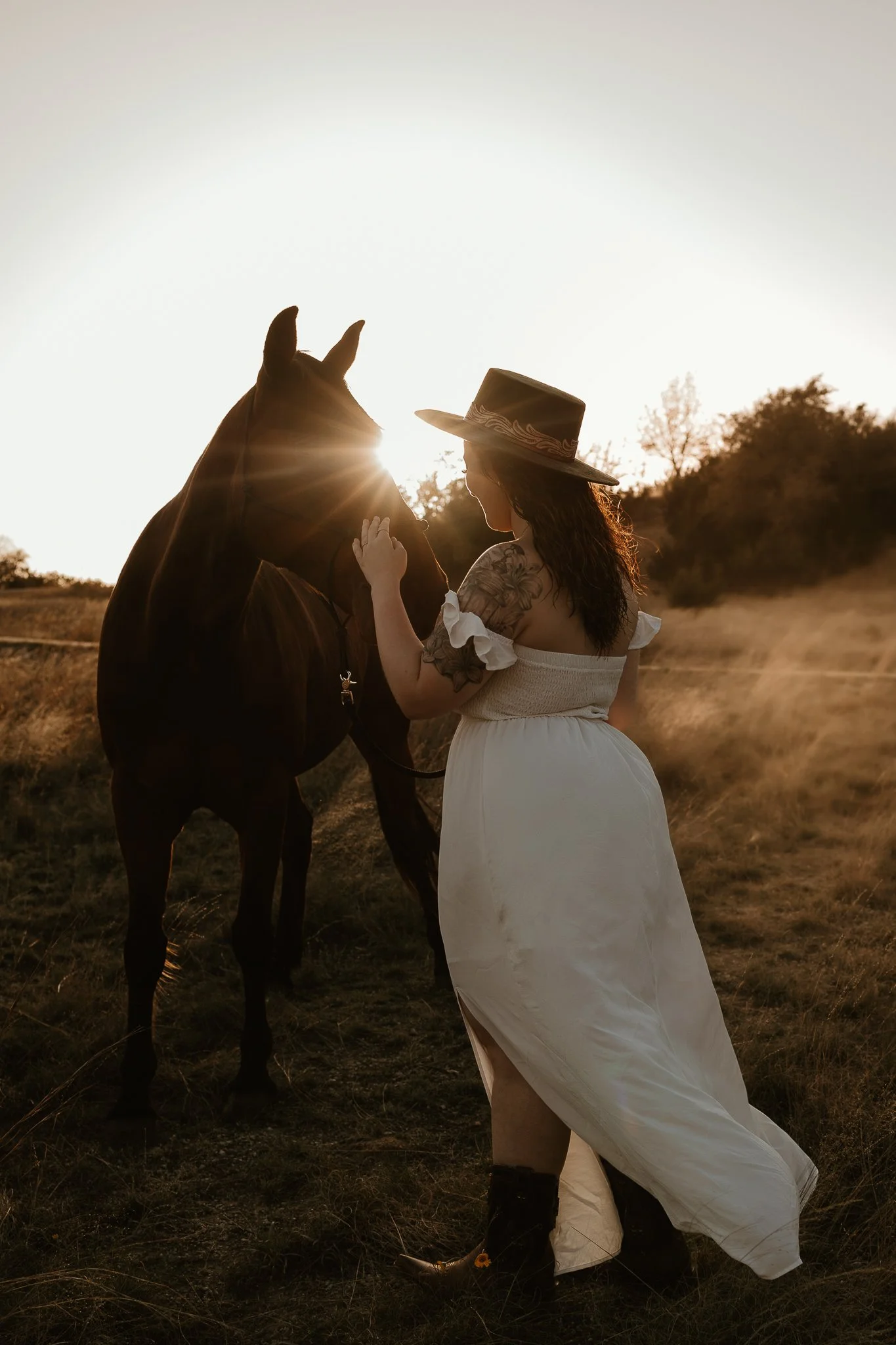 With reins in hand, a senior gently leads their horse across a sunlit pasture, showcasing their deep connection to Western heritage.