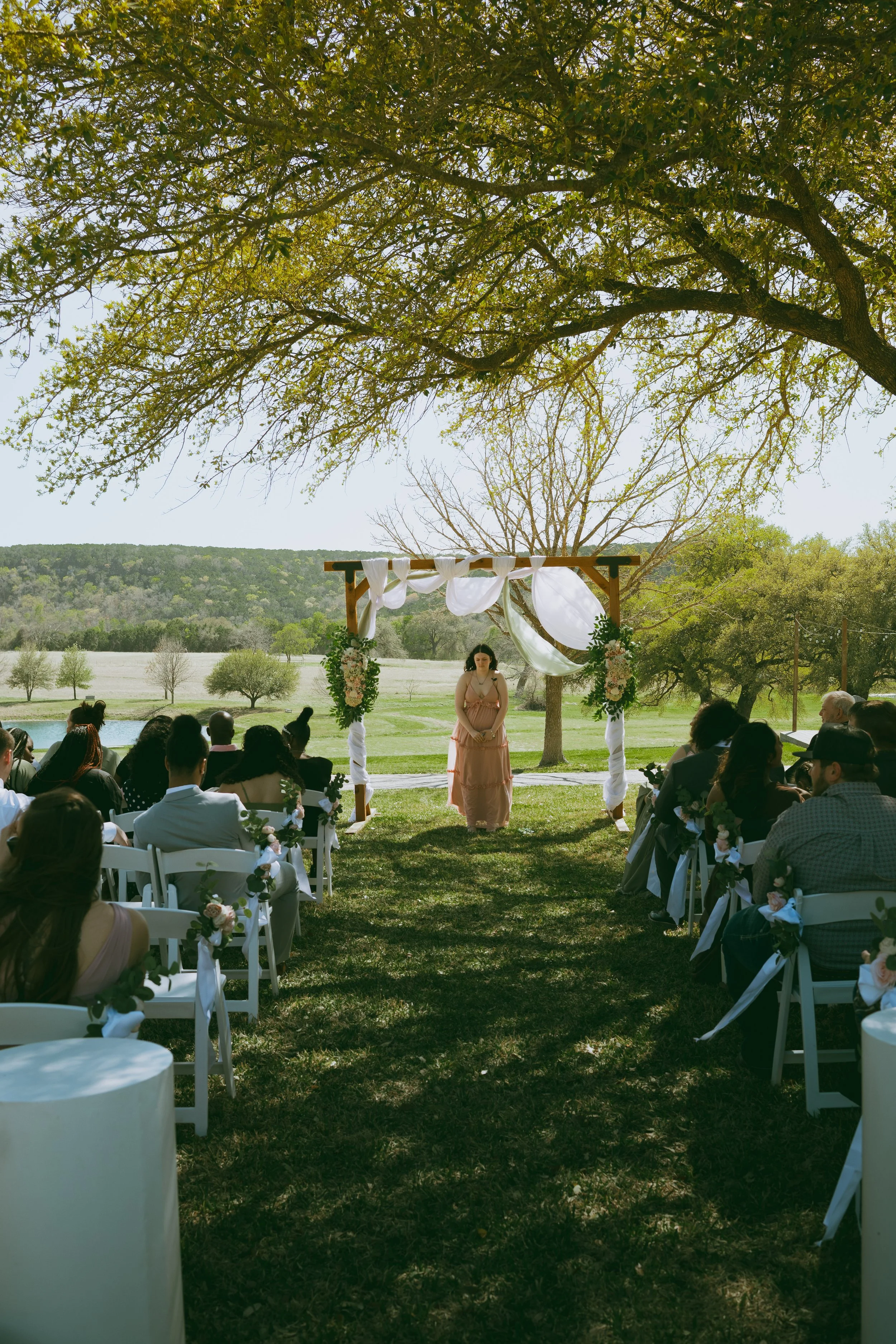 Outdoor ceremony under oak tree
