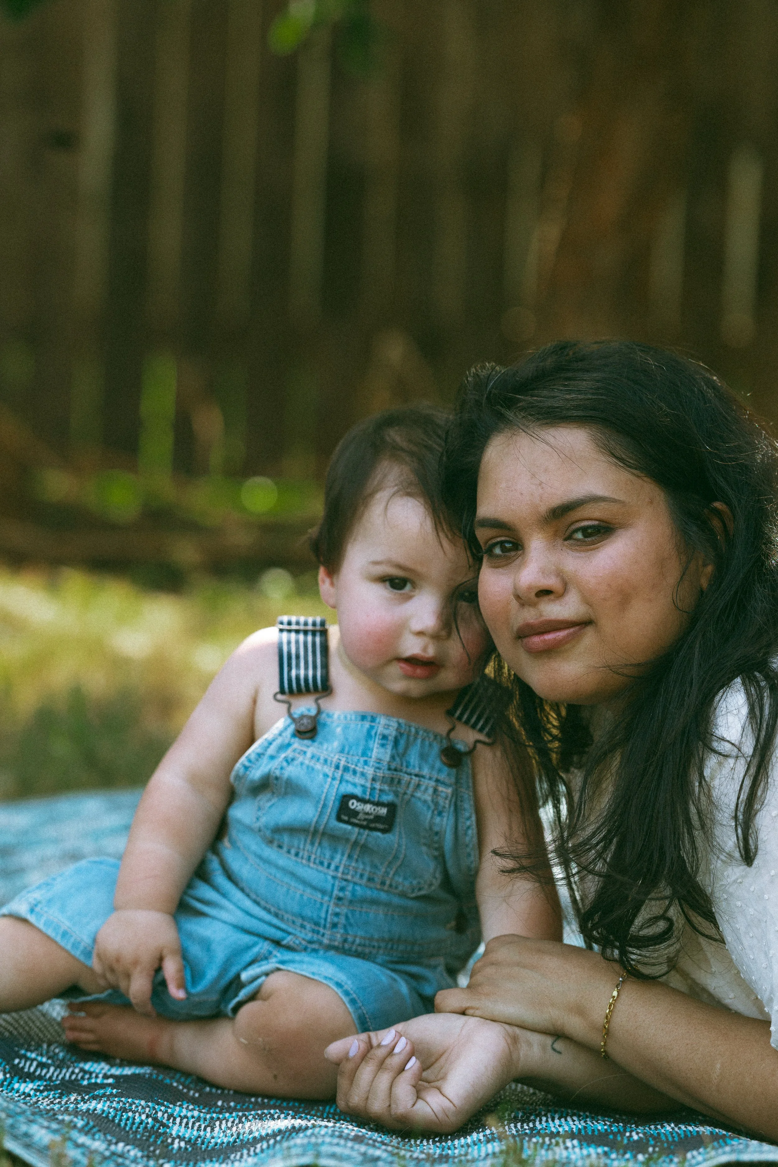 Child interacting with photographer during a documentary family photo session