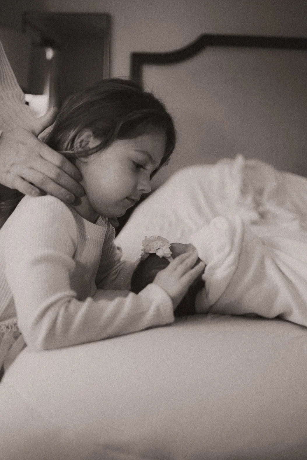 newborn smiling at sister