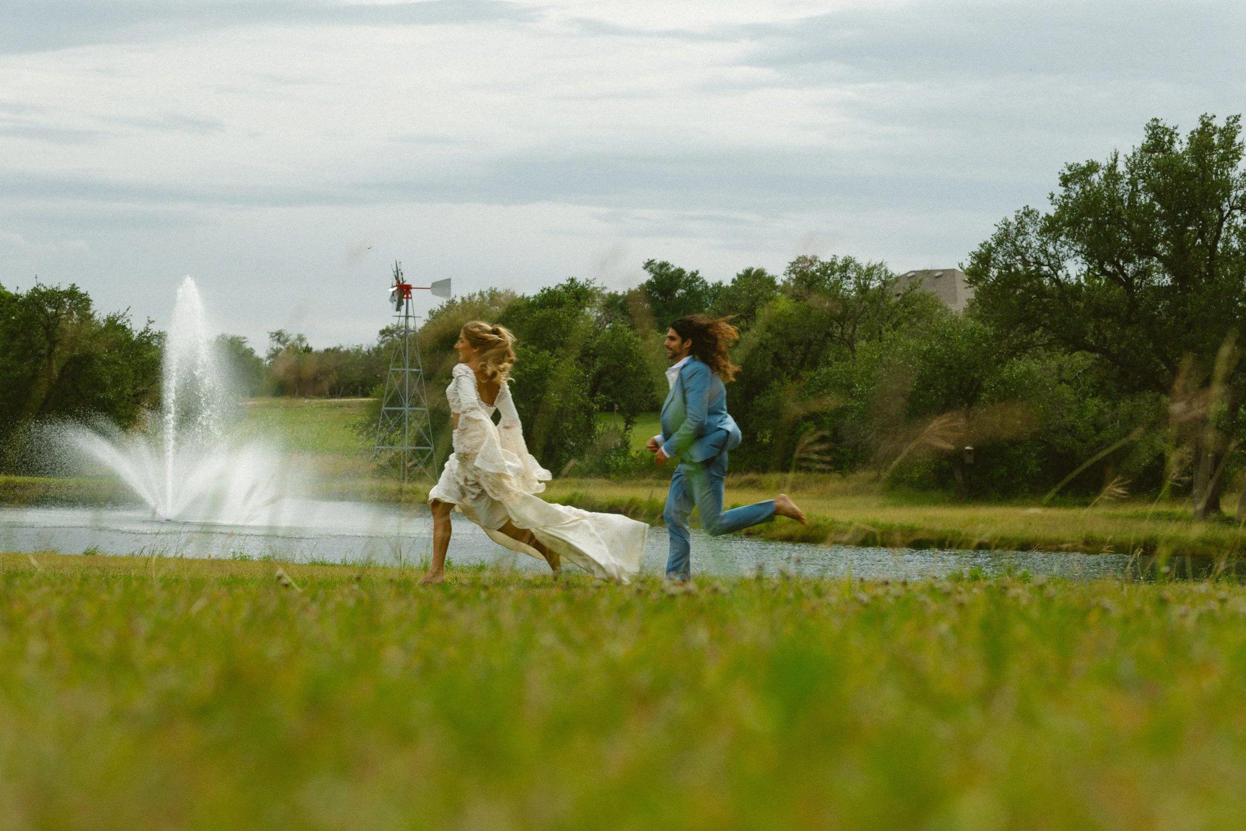 A bride and groom running at The Ma Maison in the Texas Hill Country