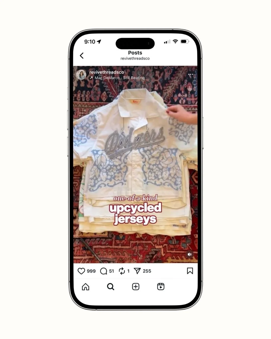 Stack of upcycled jerseys with floral embroidery, displayed on a phone screen with text "one-of-a-kind upcycled jerseys".
