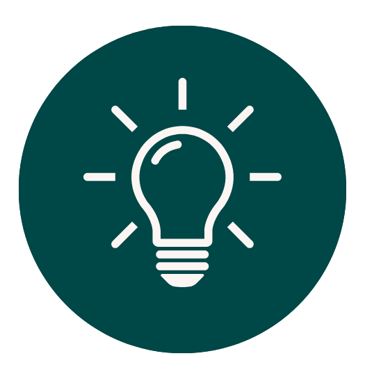 Light bulb icon with rays of light around it on a dark teal background.