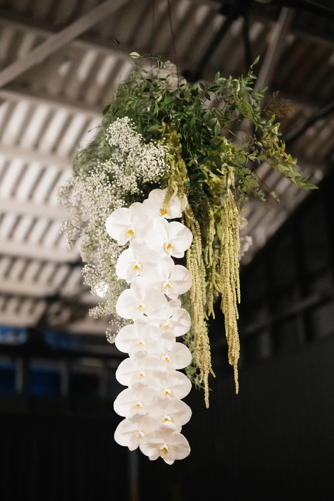 hanging flower cloud at The Refinery Brisbane Wedding venue with extra long orchids
