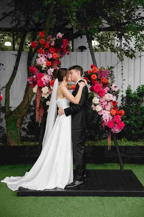 romantic florals in pinks and red at Brisbane wedding venue The Refinery