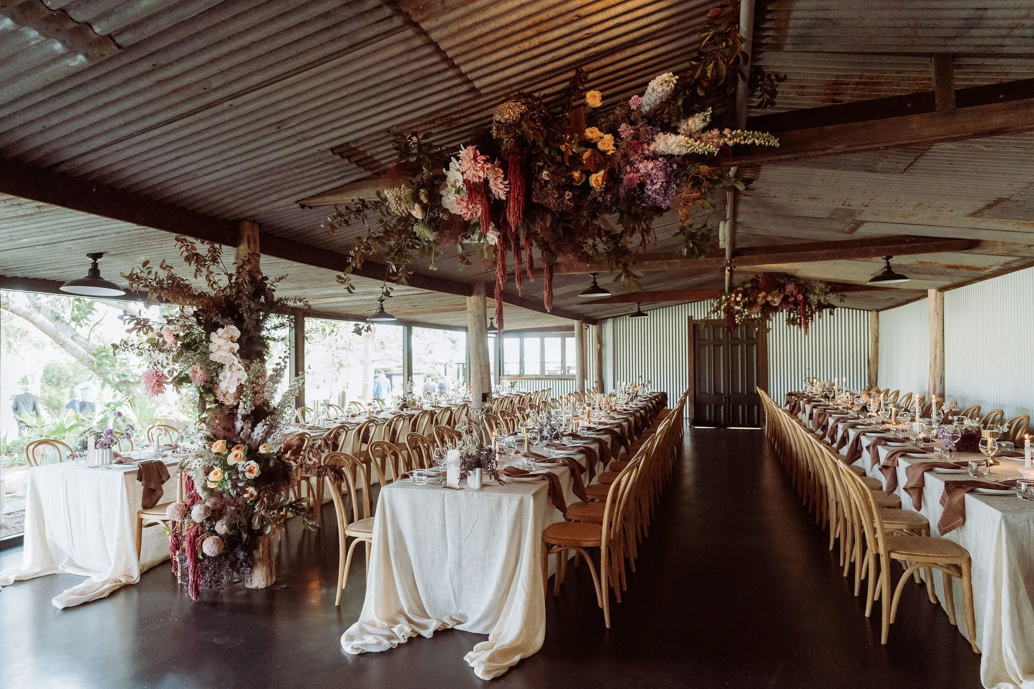 reception space decorated with flowers at scenic rim wedding venue