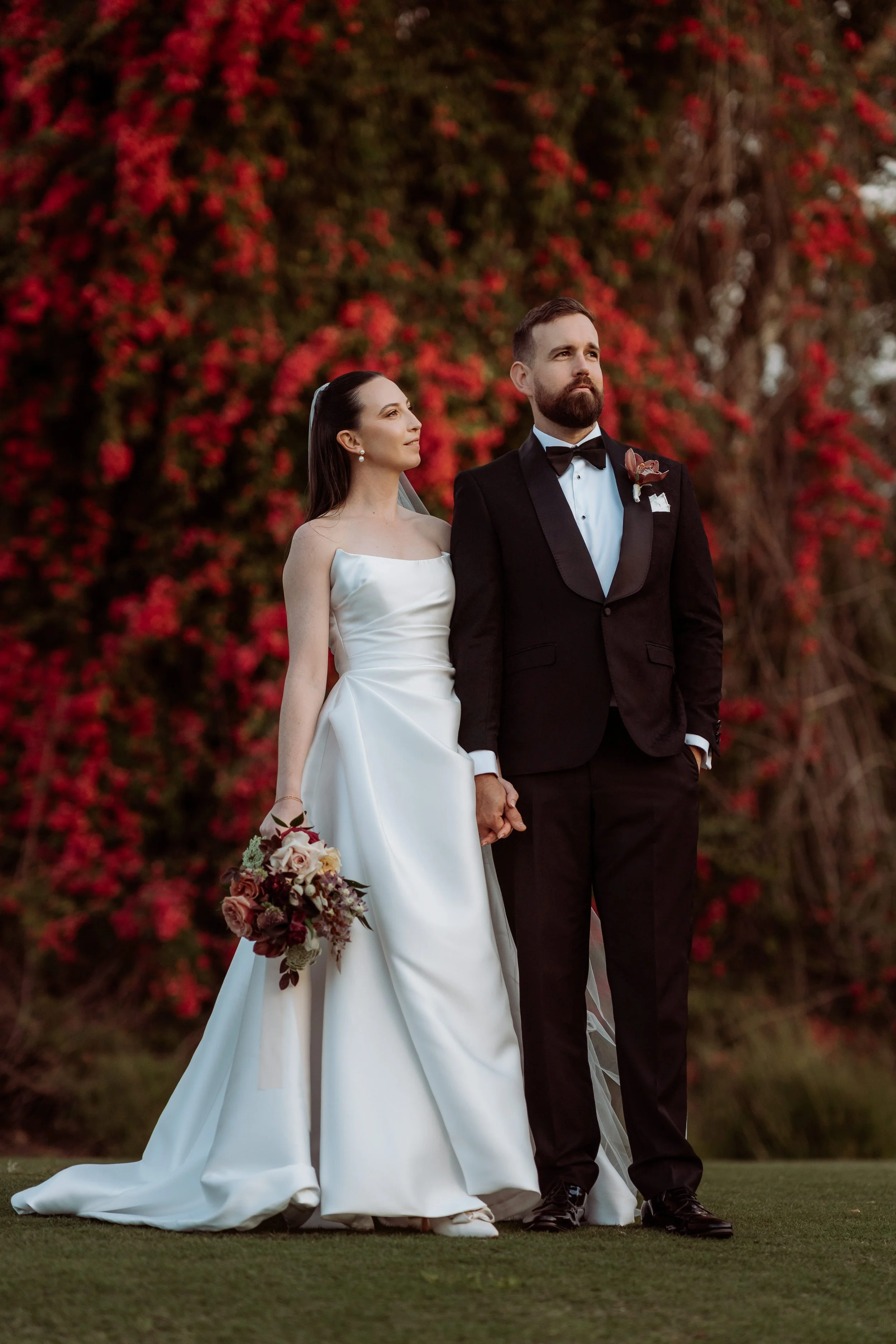 Bride and Groom in front of bougainvillea Brisbane wedding
