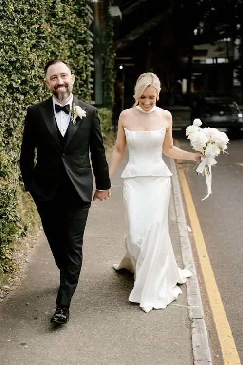 Bride and groom walking together after their wedding ceremony at The Refinery Brisbane