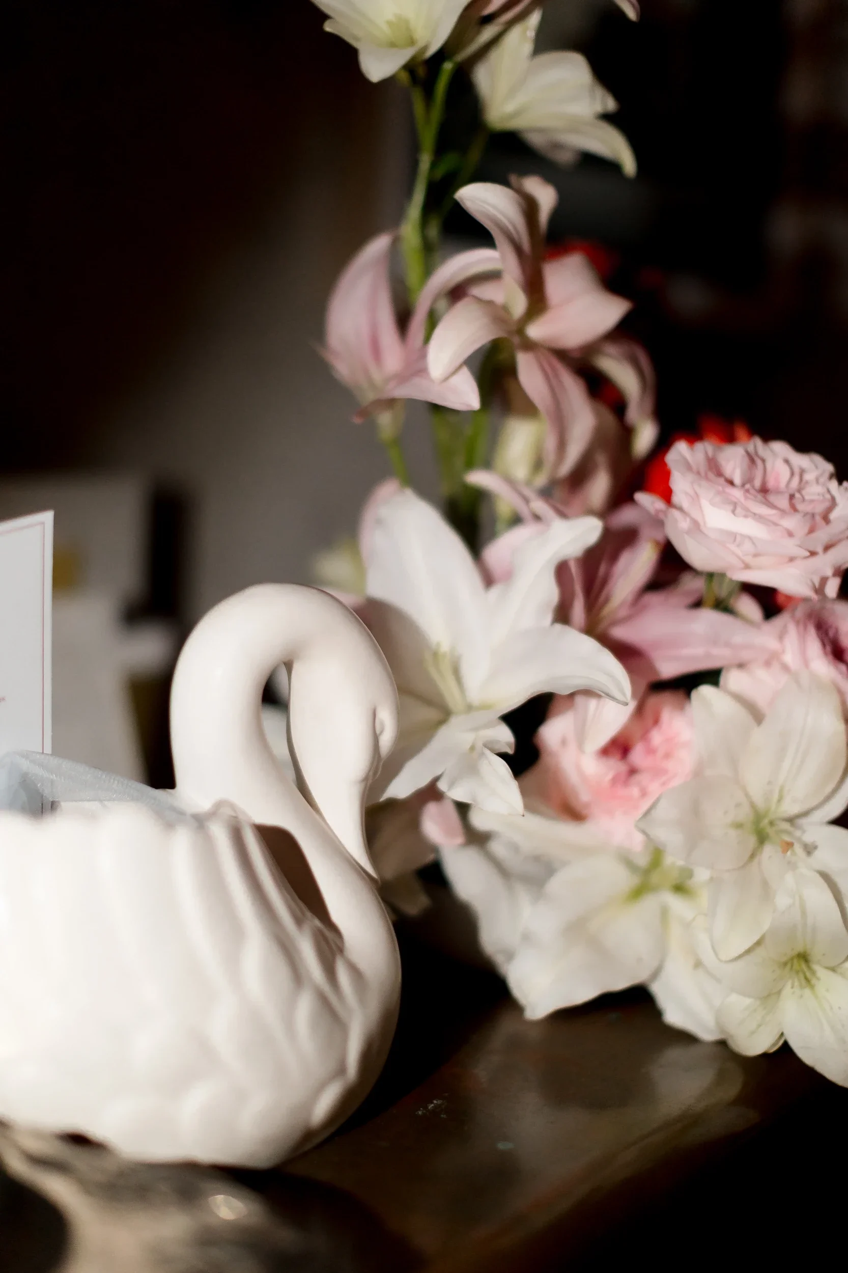 Swan vase with white lilies and blush blooms