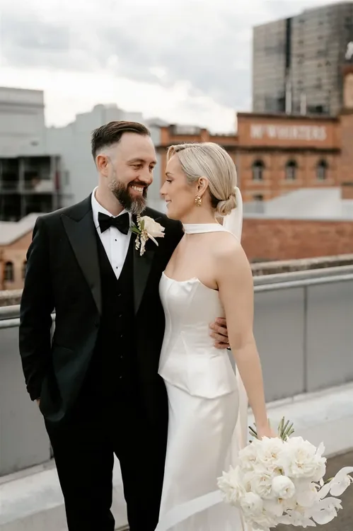 Elegant wedding couple portrait with soft white florals at The Refinery Brisbane
