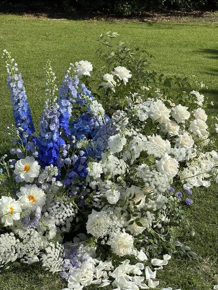 Grounded floral arbour with white roses and blue delphinium Scenic Rim