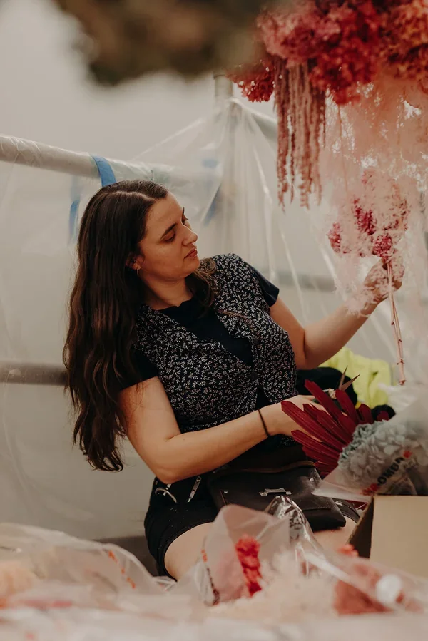 Garden Graffiti florist arranging dried florals for the West Village corporate floral installation. 