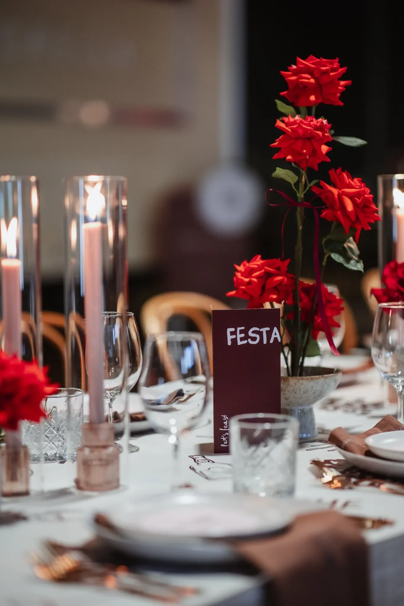 Red rose tablescape at Brisbane event with printed table-runner