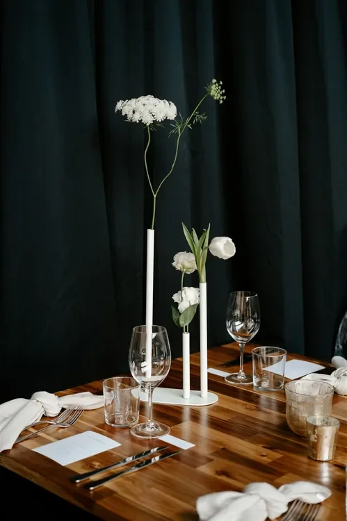 Wedding table styling details with glassware, candles and white florals at The Refinery Brisbane