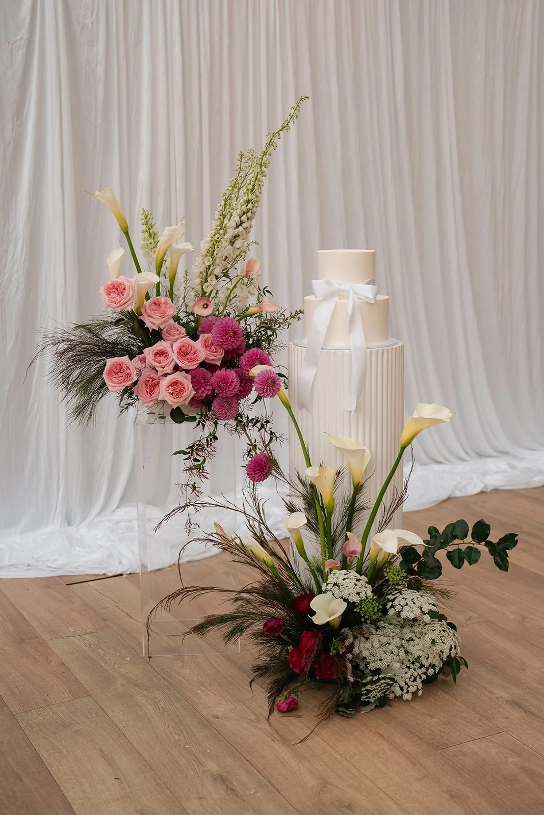 wedding reception cake table florals at The Bower Estate