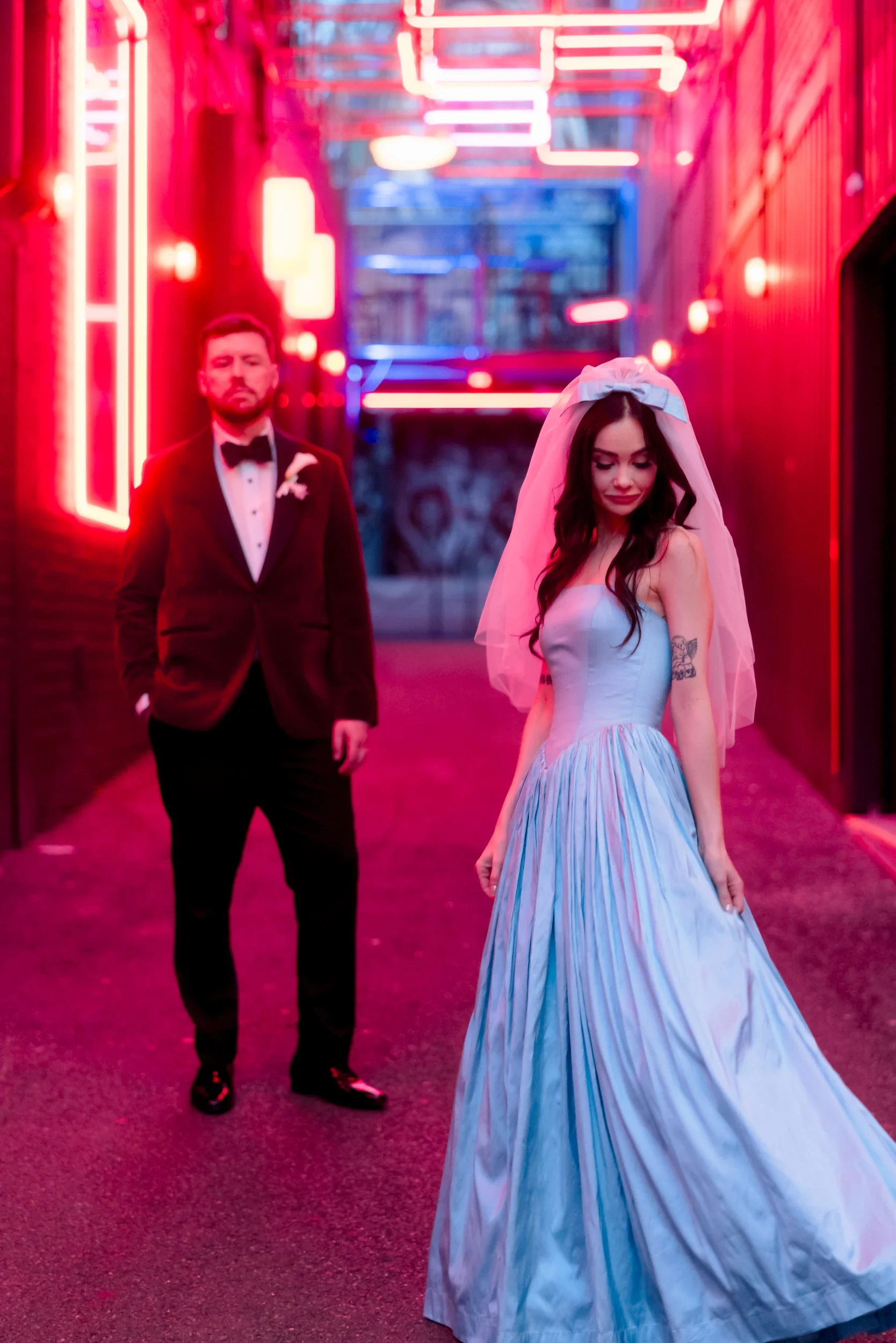 Bride and groom in a neon lit Fortitude Valley laneway