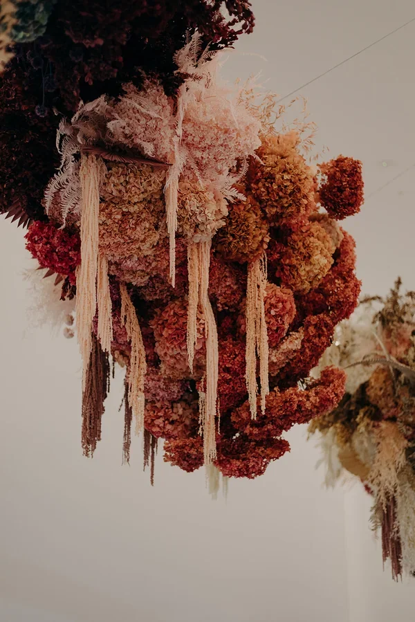 Garden Graffiti florist arranging dried florals for the West Village corporate floral installation.