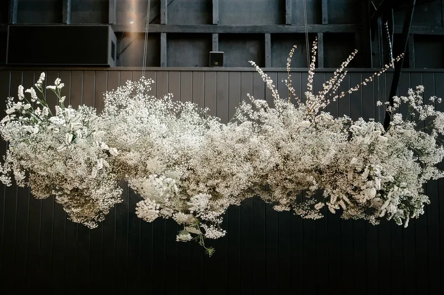 Overhead baby’s breath floral installation for a modern wedding at The Refinery Brisbane