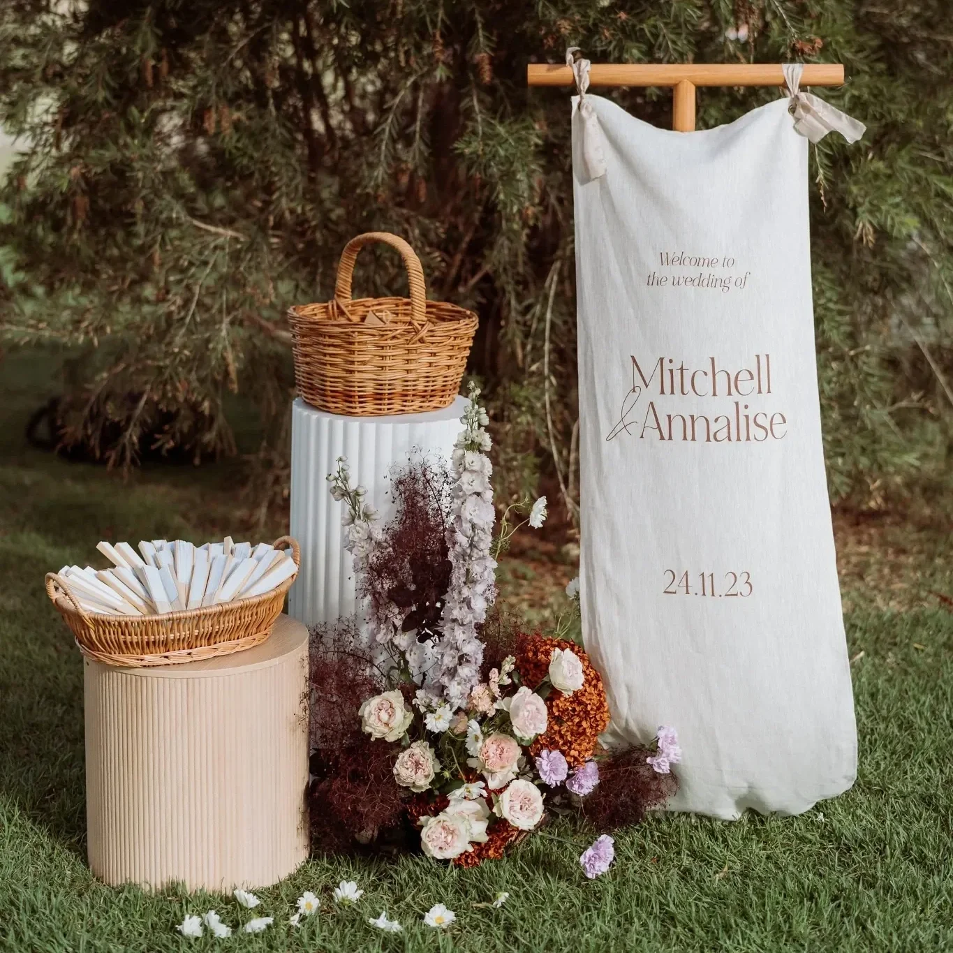 Fabric welcome sign with florals at Scenic Rim wedding