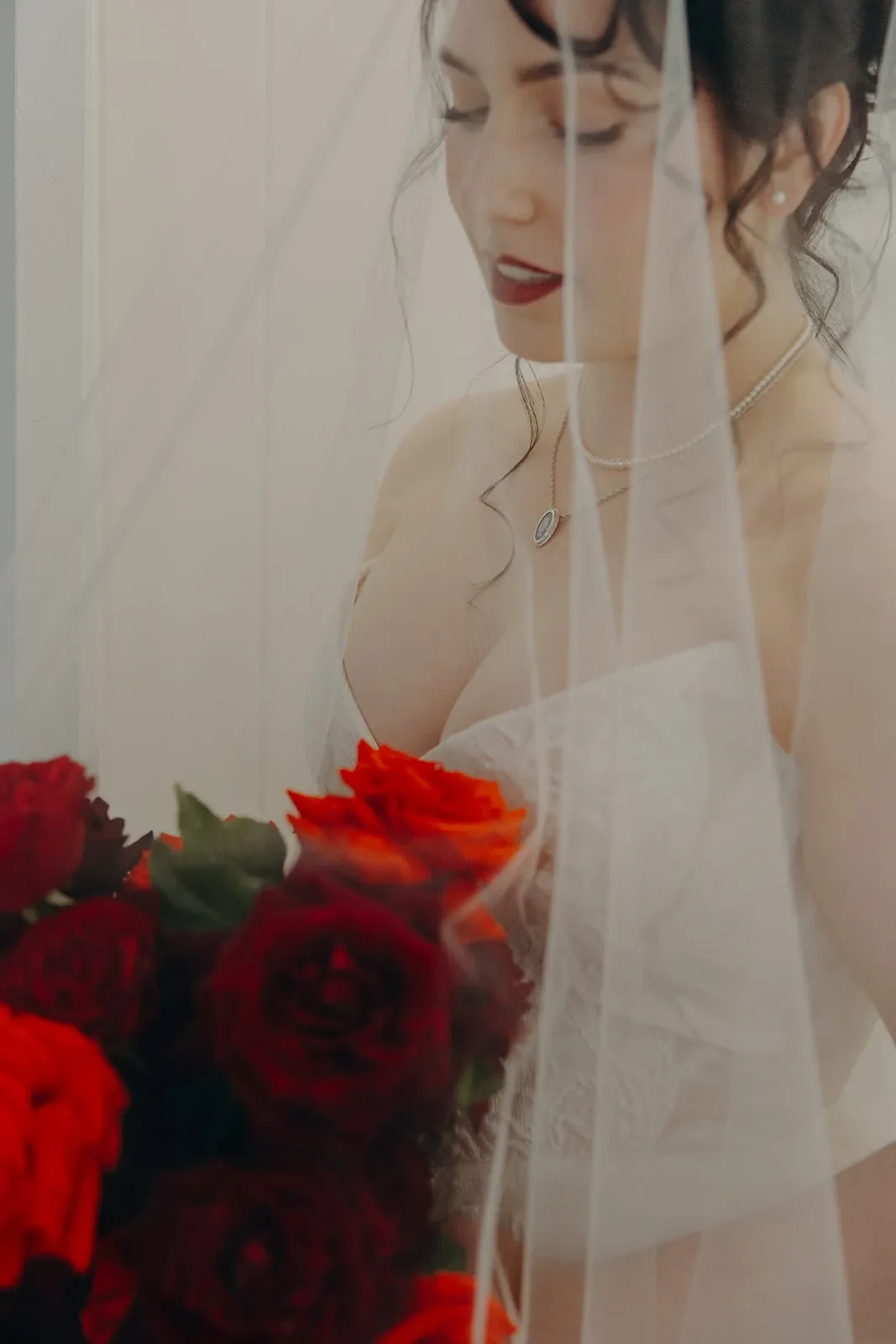 Brisbane Bride holding red rose bouquet