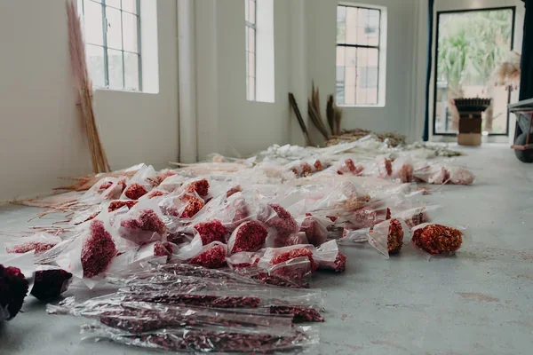 Dried florals laid out in the West Village workspace prior to assembly by the Garden Graffiti design team.