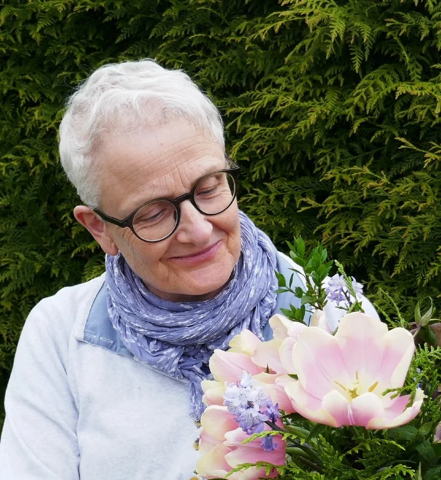 Katherine of Zinnia Floral Design holds a bouquet of locally grown tulips and bluebells.