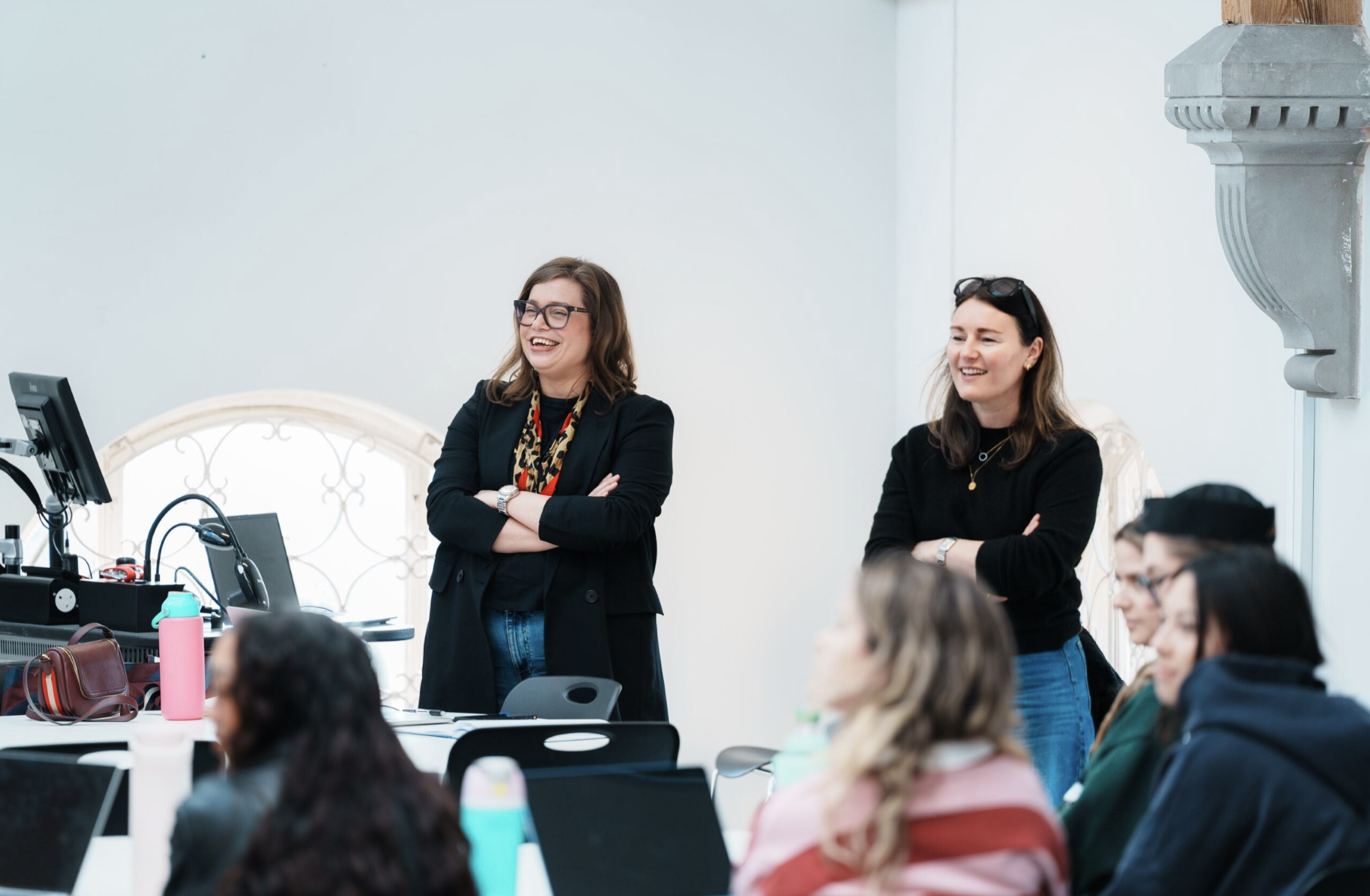 Jo Ingham and Jo Ward presenting to an engaged group of students.