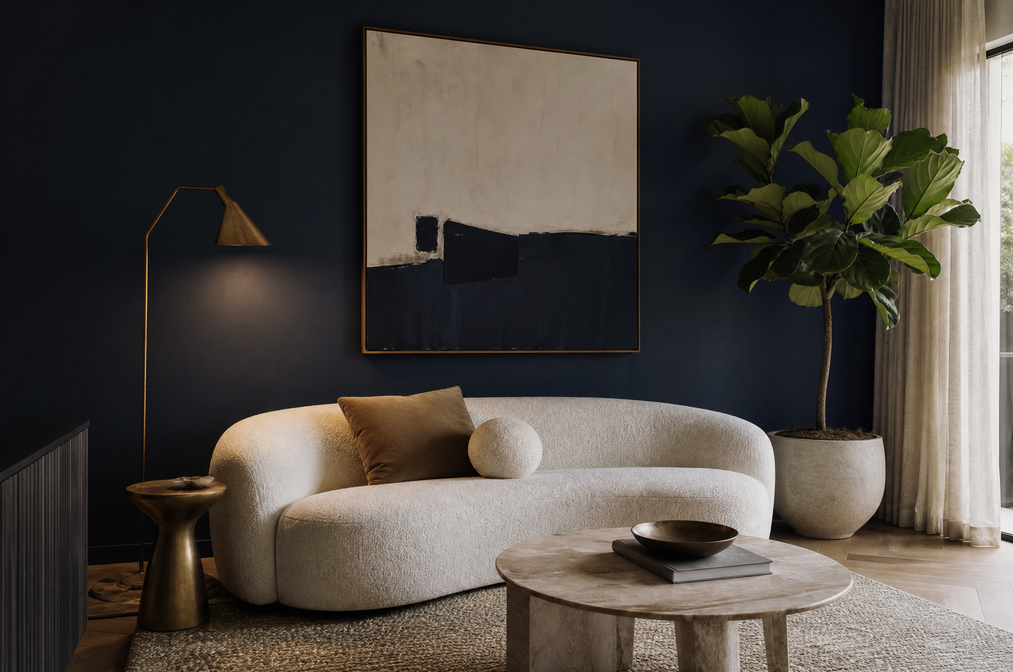 Sophisticated navy living room with boucle sofa and brass accents by Tuesday Lane Sydney